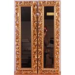 A pair of 19th century Florentine giltwood and gesso framed wall mirrors,