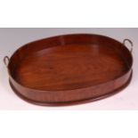 A George III mahogany gallery tray, of oval form, with twin brass carry handles, w.49cm Condition