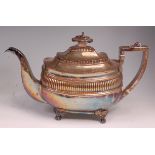 A Regency silver teapot, of oval bombe form, with reeded band, 21.8oz, maker I W, London 1814, h.
