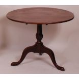 A George III mahogany pedestal tripod table,