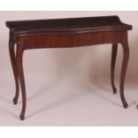 A late 18th century mahogany card table, of serpentine outline,