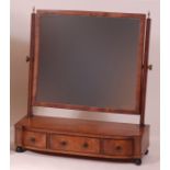 An early 19th century mahogany and ebony strung swing dressing table mirror, of good size,