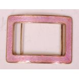 An early 20th century silver gilt and guilloche pink enamel belt buckle, of rectangular outline, 39.