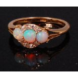 A ladies 18ct gold opal and diamond cluster ring,