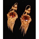 A pair of circa 1900 pinchbeck and brown topaz set ear pendants, with tassle drops,