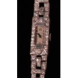 A ladies Art Deco white metal and diamond set cocktail watch, having manual wind movement,