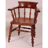 A Victorian elm seat fruitwood and yew Captain's chair, having two-piece yew toprail, dish seat,