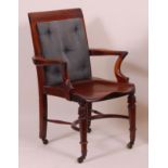 An early Victorian walnut framed library chair, having pad-back, dish-seat and crinoline