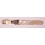 A late Victorian silver mounted paperknife, having faceted crystal handle and mother of pearl blade,