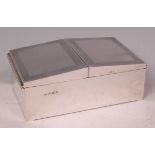 An Art Deco silver twin section table cigarette box, the hinged covers with engine turned Greek