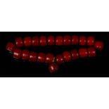 A beaded cherry amber necklace, comprising 23 cylindrical beads, gross weight 53g, each bead dia.1.