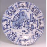 An early 18th century English Delft charger, probably Bristol, underglazed blue and white