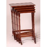 A Sheraton style yew wood quartetto nest of occasional tables,