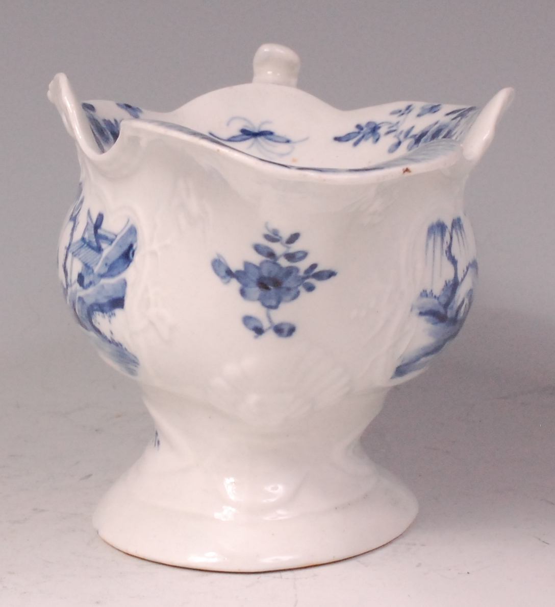 An early Worcester porcelain sauceboat, relief moulded and underglaze blue decorated with - Image 2 of 6