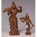 An Indian brass shrine deity figure of Rama, in standing pose bearing Shiva's bow and a quiver of