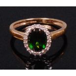 A ladies 9ct gold green tourmaline and diamond set dress ring,