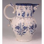 An English pearlware mask jug, of baluster form, moulded with cabbage leaves and further