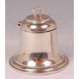 An Edwardian silver bell shaped inkwell, having hinged cover and loaded base, makers mark worn,