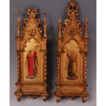 A pair of circa 1900 Italian polychrome giltwood panels depicting religious icons,