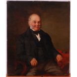 19th century English school - Half length portrait of a seated gentleman holding his reading