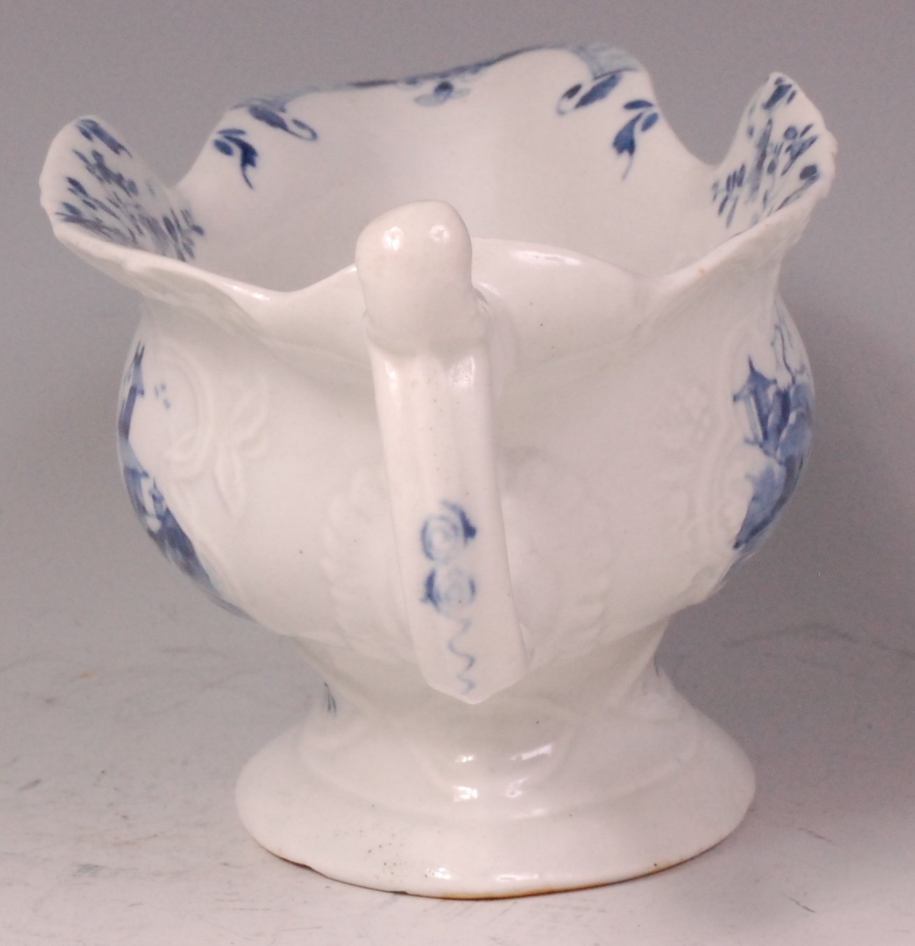 An early Worcester porcelain sauceboat, relief moulded and underglaze blue decorated with - Image 4 of 6