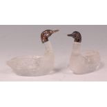 A pair of Edwardian moulded glass and silver table salts, in the form of ducks, London 1906, h.5.