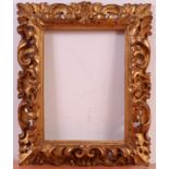 An 18th century Florentine giltwood and gesso picture frame, with C scrolls and acanthus leaves,