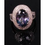 A contemporary ladies 14ct white gold tanzanite and diamond cluster ring,