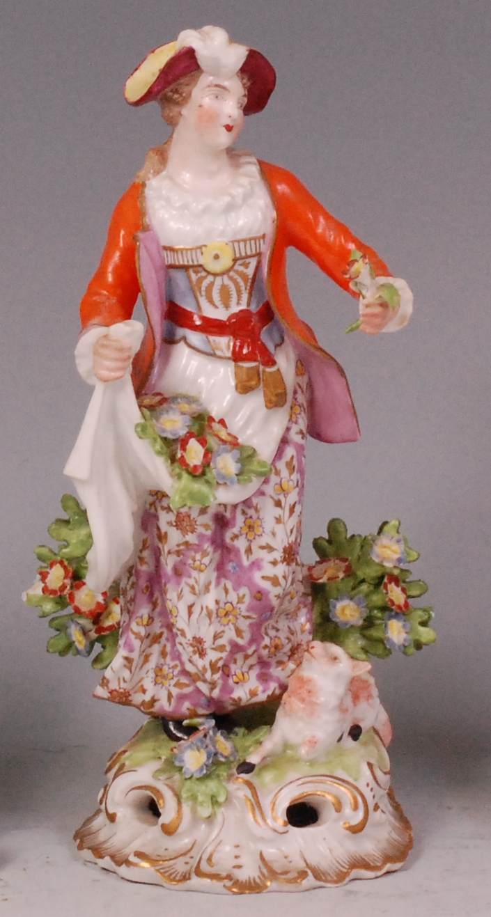 An 18th century Derby figure of a Dresden Shepherdess,