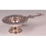 A circa 1900 Dutch silver PLATED tea strainer on stand, the handle modelled as a windmill,