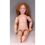 A Simon & Halbig 1039 bisque headed doll, having jointed composition body, flirty brown eyes and