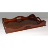 A George III mahogany tray, having a full wavy gallery, 61 x 40cm Condition Report / Extra