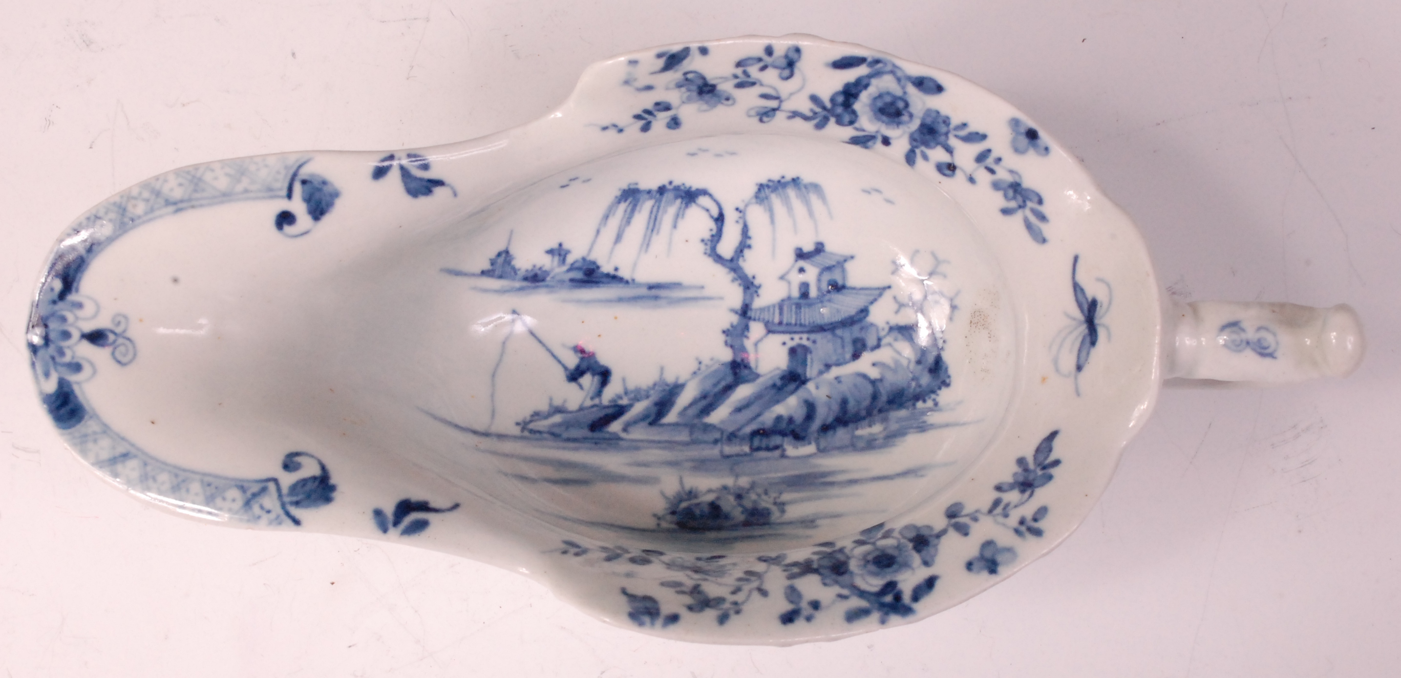 An early Worcester porcelain sauceboat, relief moulded and underglaze blue decorated with - Image 5 of 6