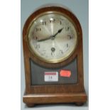 An early 20th century oak cased mantel clock