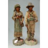 A pair of early 20th century continental painted composition figures