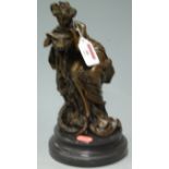 A reproduction bronze group depicting a maiden upon mythical beast