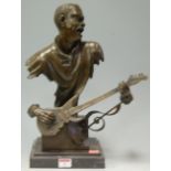A contemporary bronze sculpture of a Black American musician