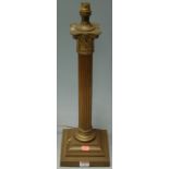 A late 19th century lacquered brass Corinthian column table lamp (fitted for electricity)