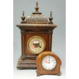 A circa 1900 Continental walnut cased mantel clock;