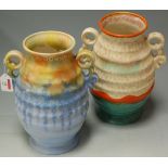 A pair of mid-20th century ribbed twin handled vases with drip-glazed decoration,