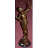 A reproduction bronze figurine depicting Diana the Huntress