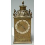 A 16th century style brass cased table clock, having French brass cylinder movement,