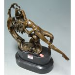 Reproduction bronze sculpture of a reclining nude maiden