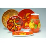 A quantity of 1960s Poole Pottery wares each decorated in bright colours to include vase, bowl,