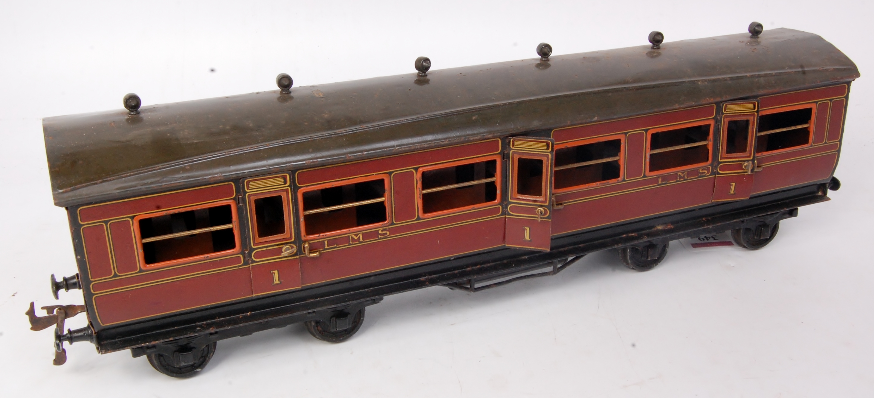 Bing GI maroon LMS 1st class corridor coach, some crazing to varnish on sides, roof pitted,