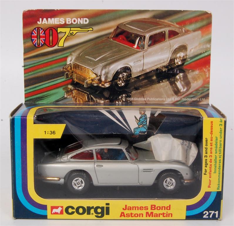 Corgi Toys, 271 James Bond Aston Martin, silver body with red interior, gold radiator and bumpers,