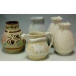 Four Victorian relief decorated jugs,