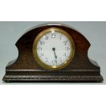 A mid-20th century French oak cased mantel clock,