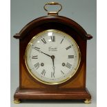 A modern mahogany and satinwood inlaid cased mantel clock,