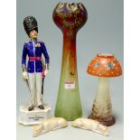 A Loetz style painted glass vase, together with a Coldstream Guards Officer figure, glass vase in